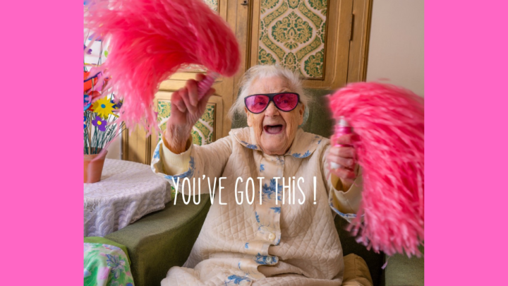 Old woman shaking pink pom-poms with the verbiage You've got this